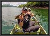 Dan unhooks the Gator sopon from AL's Smallmouth. The fish are not big but are plentiful this time of the year and are much fun to catch on light tackle.