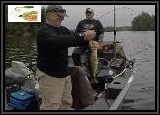 Dennis picks up a Largemouth on the Booyah green/yellow 1/2 oz skirt spinner bait.