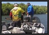 Dan checks out the weight of Pete's 6 lb Largemouth Bass!!