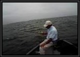 Vinny getting another tap tap... he was the HIGH hitter again on this trip. Notice the choppy water.