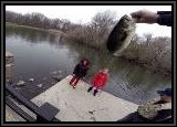 AL let's the writer check out their fish as the Kids watch. This was a super nice fish for this lake!